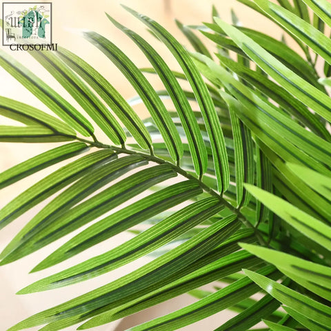 Vibrant green artificial areca palm frond with detailed striped texture from crosofmi artificial plants for indoors and outdoors