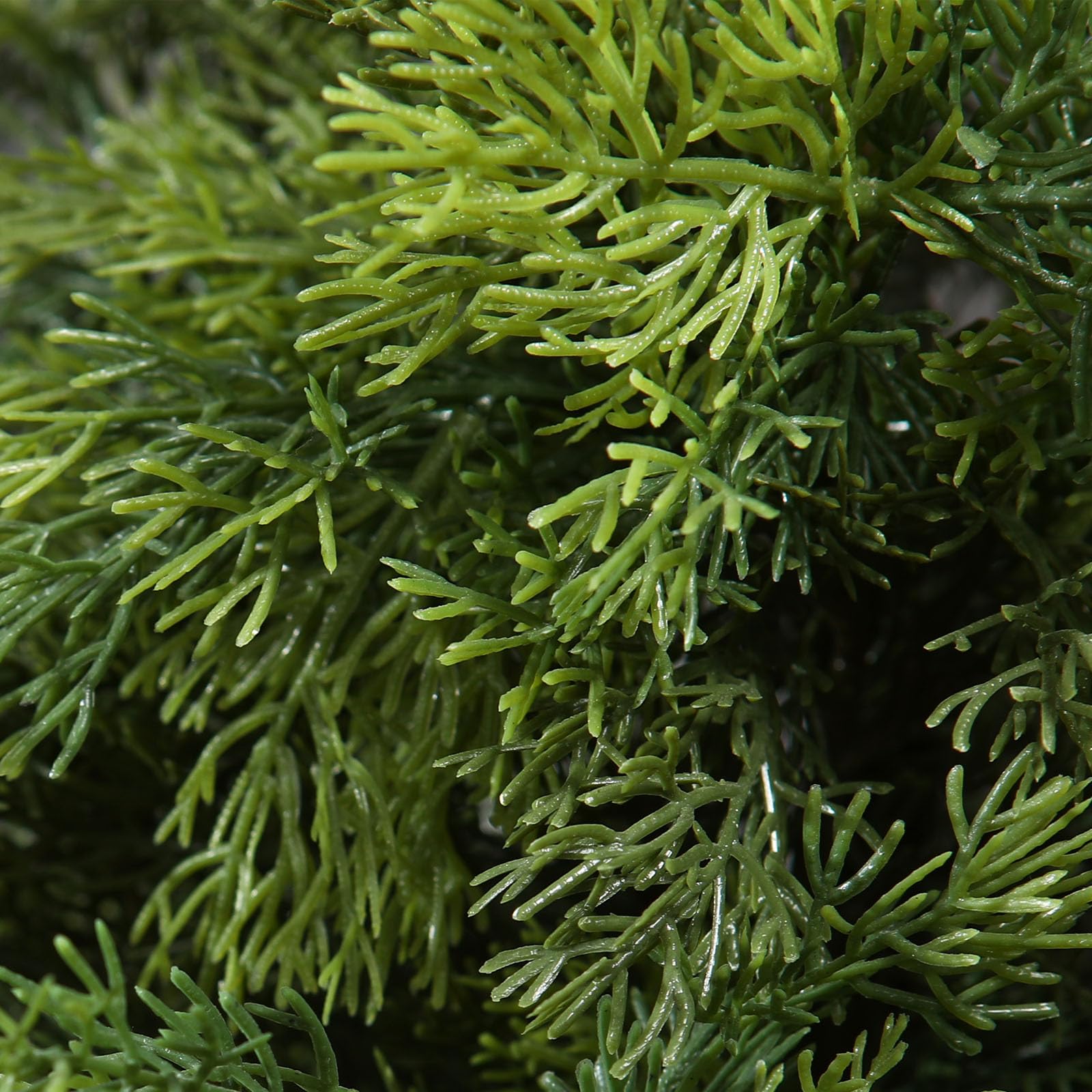 Vibrant green artificial cedar tree with feathery fronds in plastic pots for garden and porch decoration