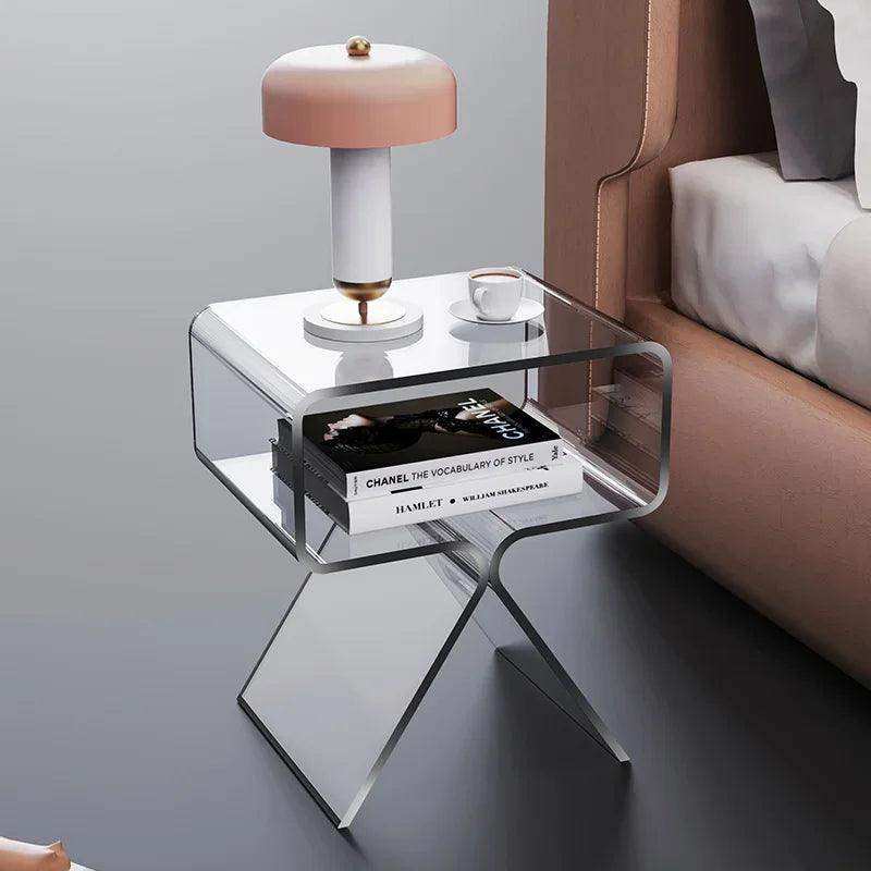 Modern acrylic nightstand with sleek transparent acrylic design and angular legs perfect for stylish bedside use