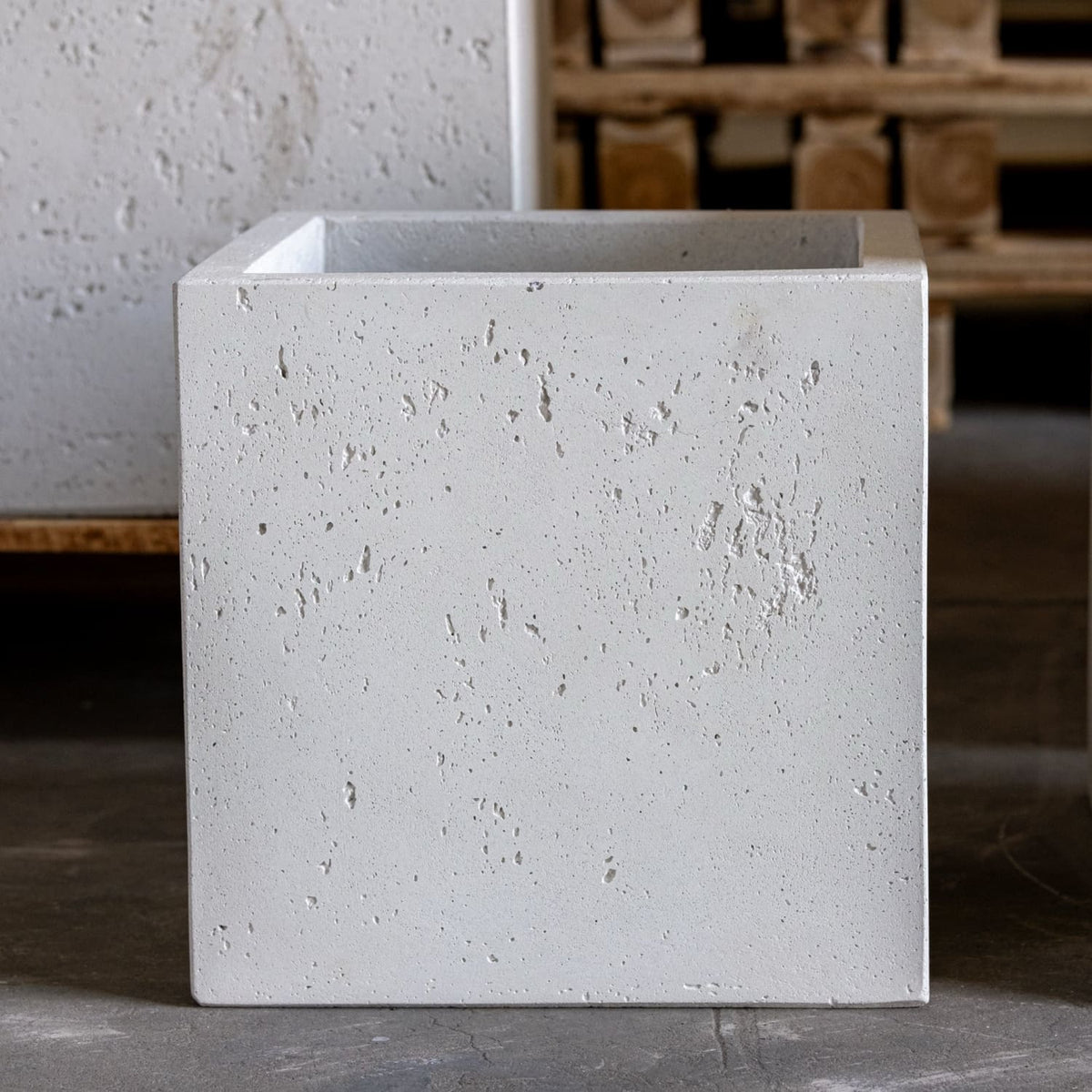 A minimalist white mist concrete plant pot with a textured speckled surface and clean 20cm x 20cm square edges