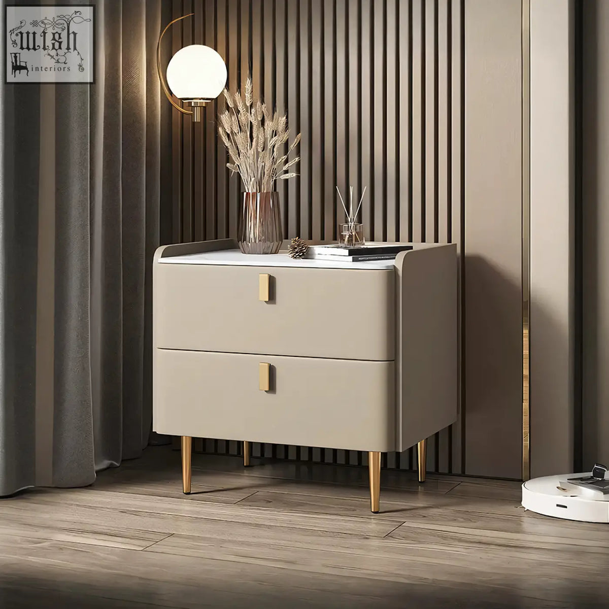 Beige two-drawer cunha bedside table with gold-tone handles and legs in a sleek modern design