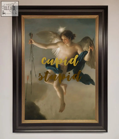 A cupid stupid foil framed print featuring an angelic cupid with blue drapery in a dark brown and gold frame