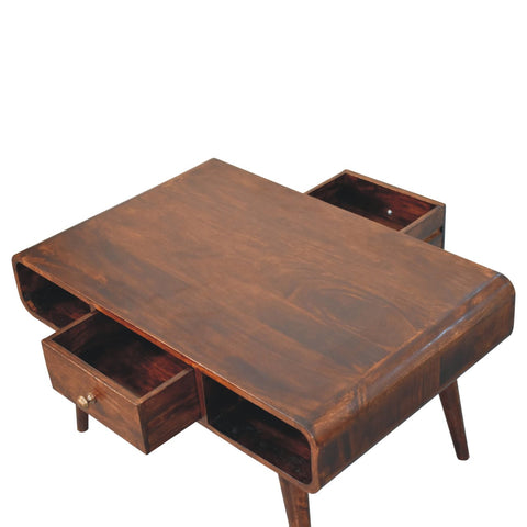 Brown curved california walnut coffee table with two open drawers and tapered legs made from solid mango wood