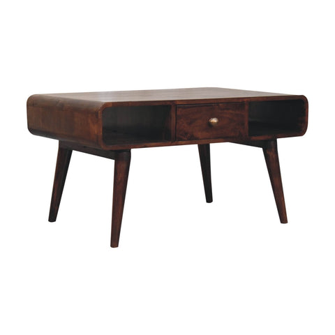 Dark brown curved california walnut coffee table with tapered legs and a drawer made from solid mango wood