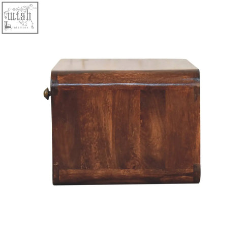 A rustic brown curved california walnut wall mounted bedside with brass latch and solid mango wood grain details