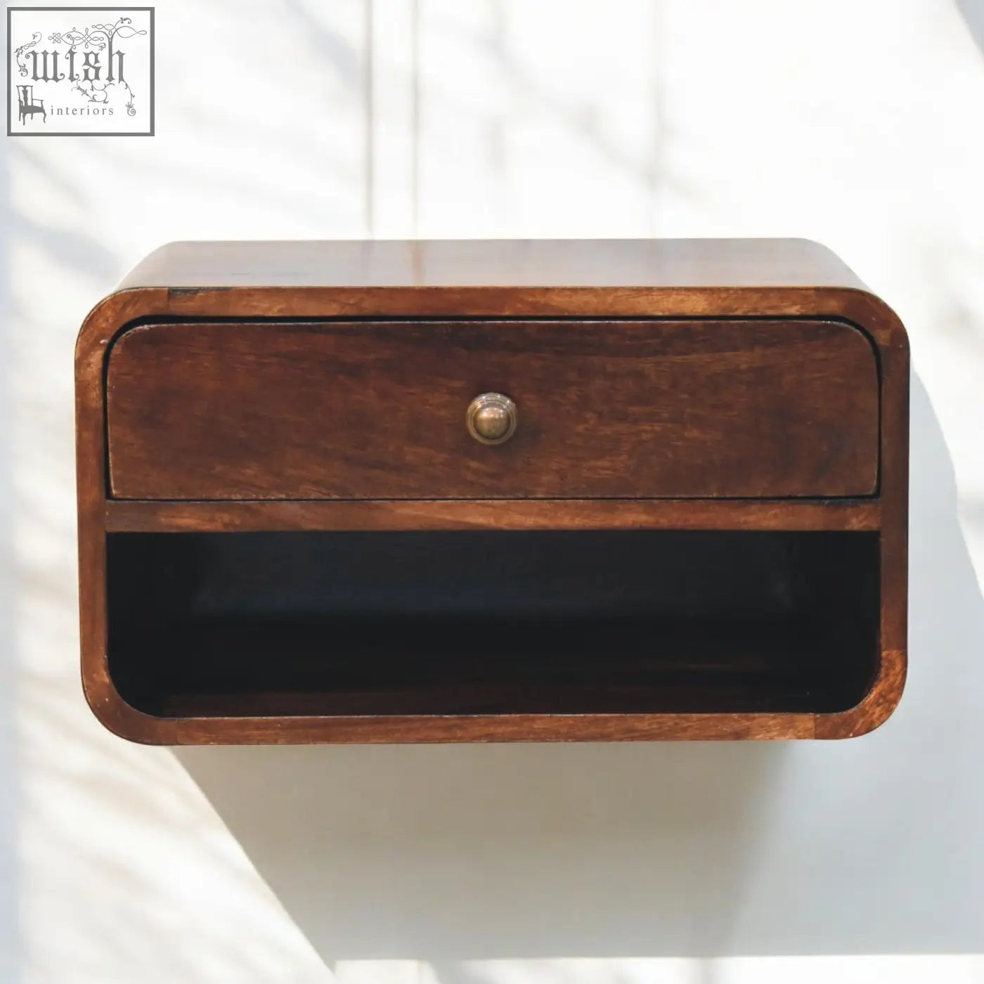 A sleek dark brown california walnut nightstand with single drawer and brass knob made from solid mango wood