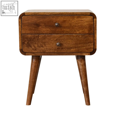 A warm brown wooden curved chestnut bedside table with two drawers and tapered legs for bedroom use