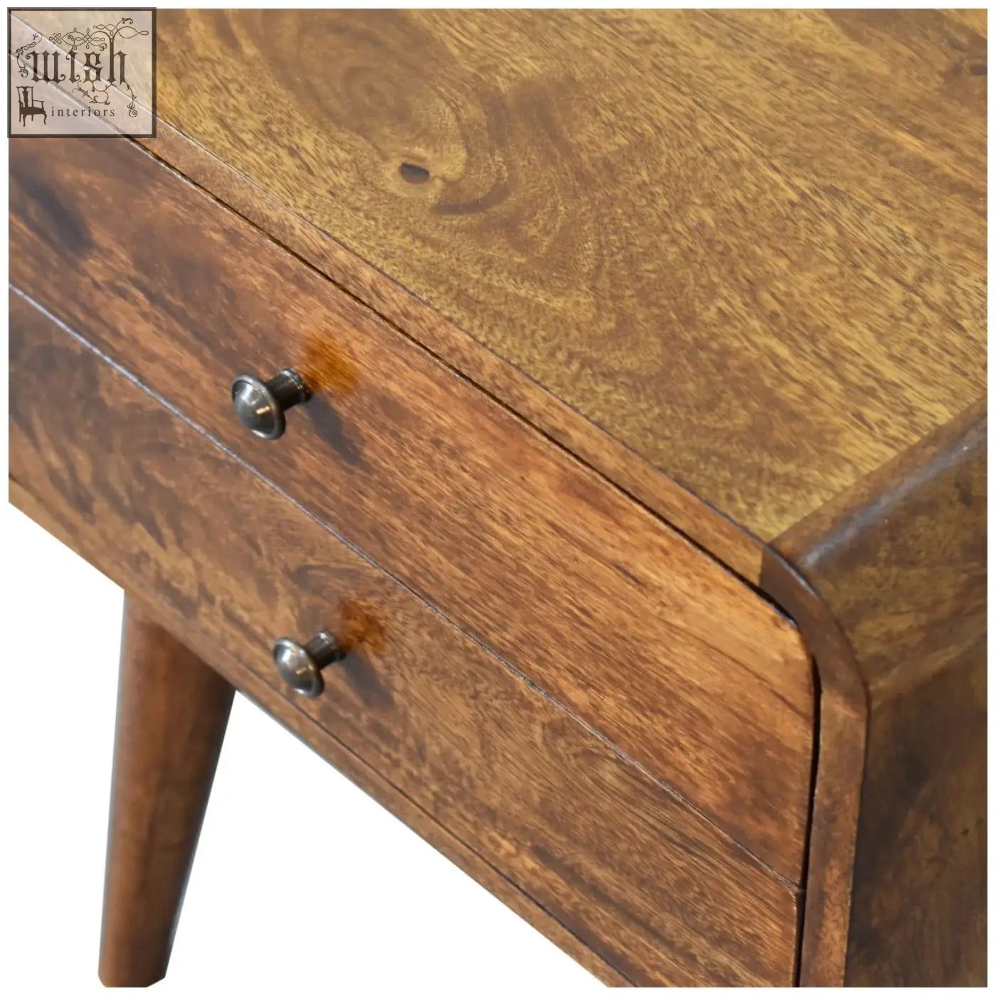 Curved chestnut bedside table in medium brown wood with two drawers silver knobs and tapered legs