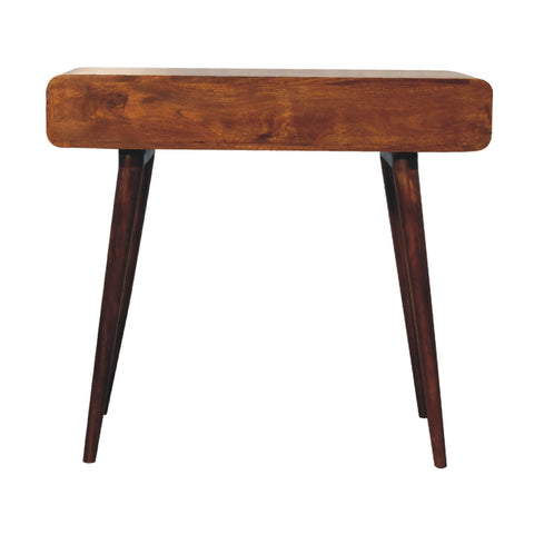 A curved chestnut writing desk with a warm medium-brown rustic wooden finish and tapered legs perfect for any workspace