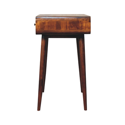 A sleek dark brown wooden curved chestnut writing desk with a rectangular inlaid top and four tapered legs