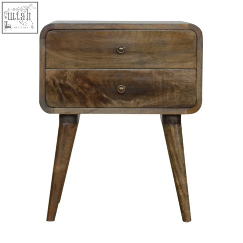 A rustic bedside table with two drawers and tapered legs in a warm brown finish with brass knobs, not grey washed