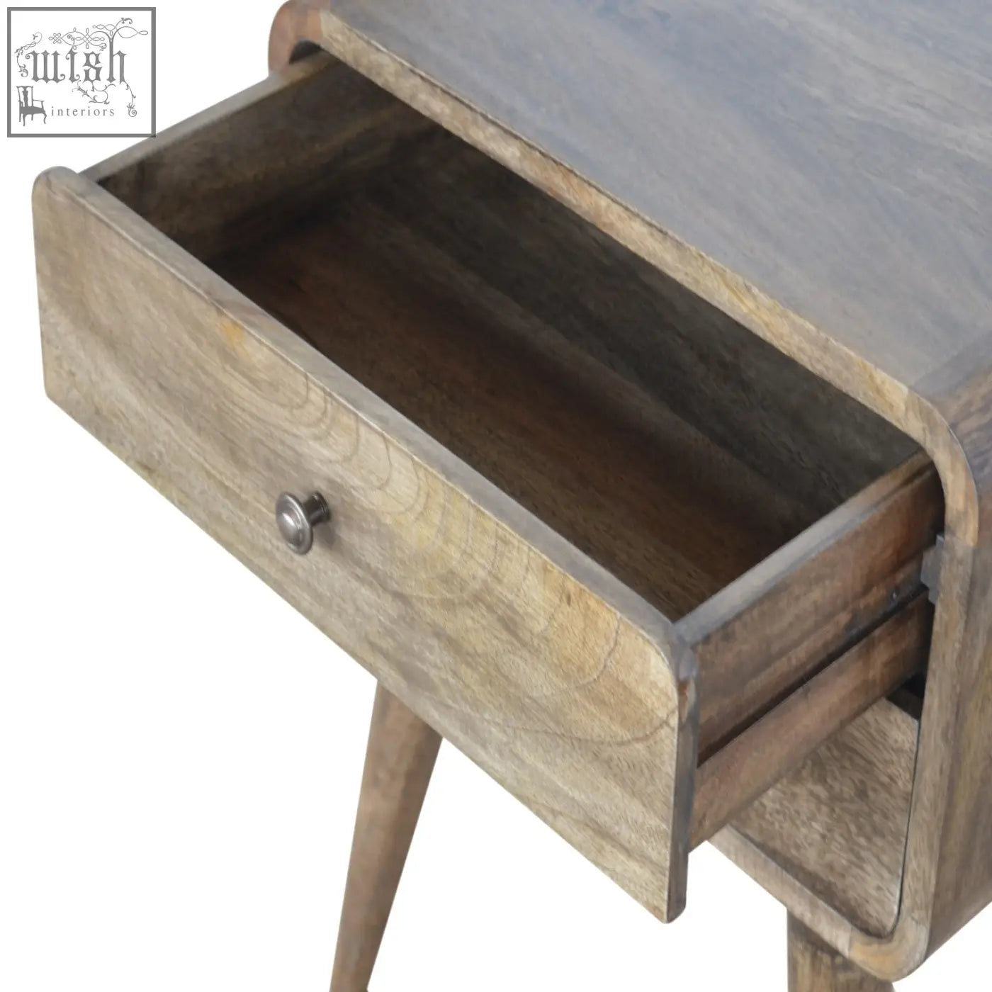 A rustic wooden bedside table with a single drawer and slender tapered legs in a grey washed finish