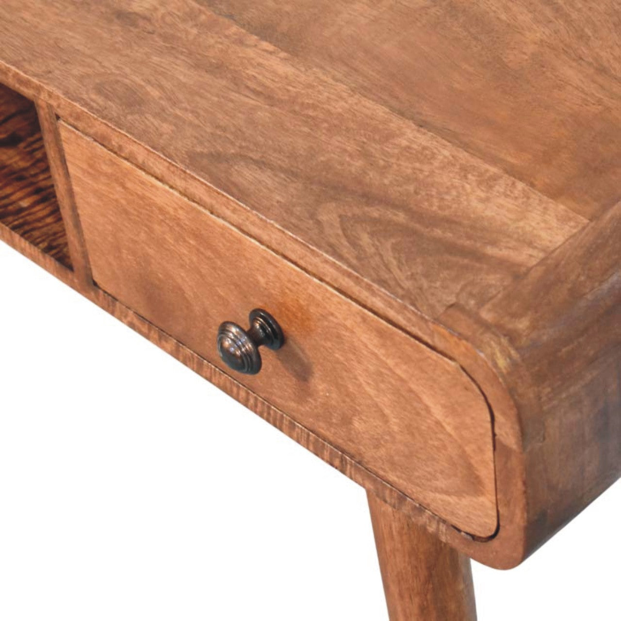 A warm medium-toned wooden curved writing desk with a single drawer and ornate black metal knob