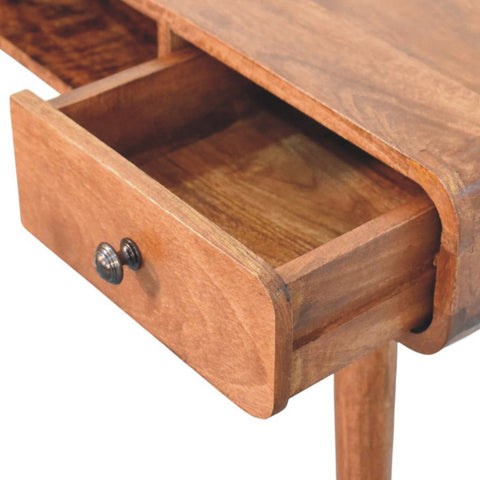 Warm-toned wooden curved writing desk drawer with rounded front and dark metallic knob for stylish storage