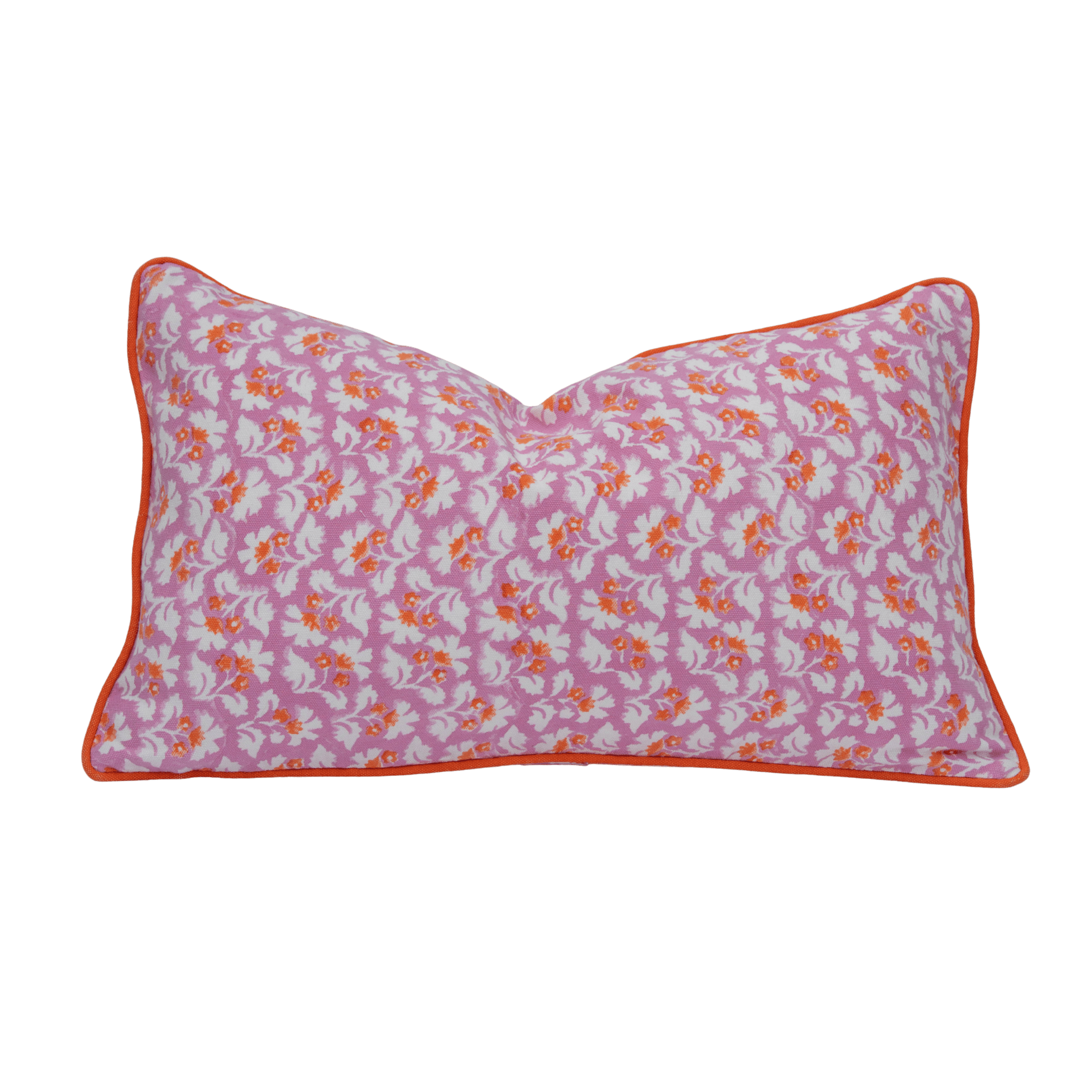 A rectangular pink burnt spice cushion cover with hand block white and orange floral pattern and orange piping trim