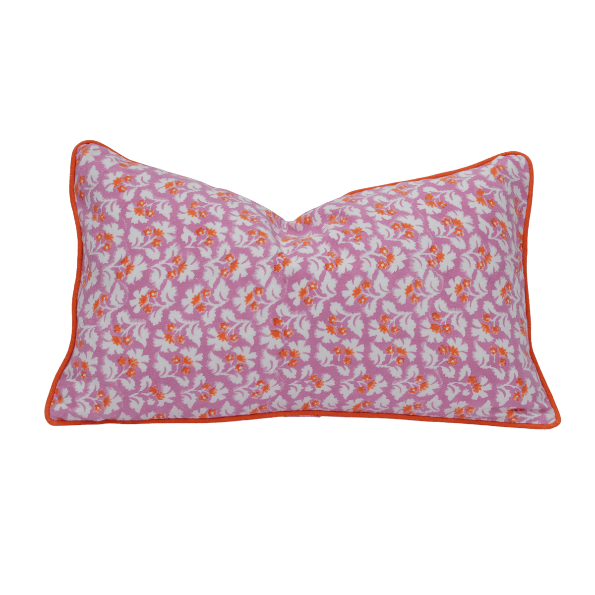 A rectangular pink burnt spice cushion cover with hand block white and orange floral pattern and orange piping trim