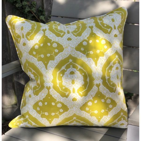 A vibrant yellow and white patterned cushion cover with an intricate damask design called celery trellis