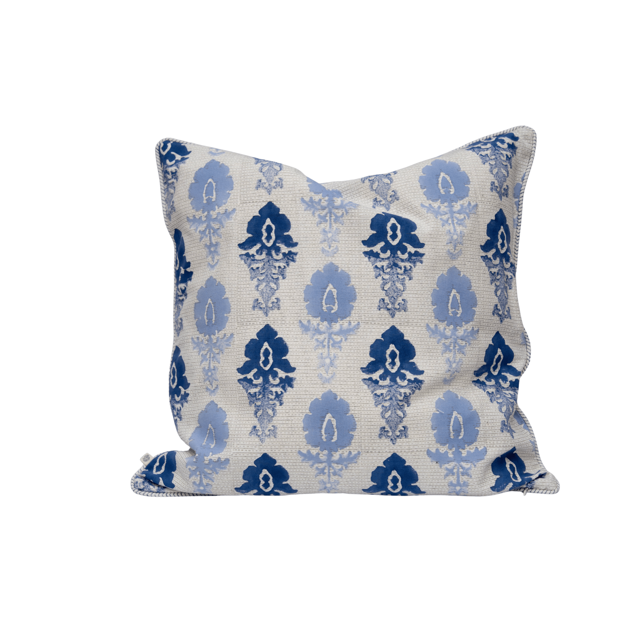 A cushion cover with a cream base and intricate indigo fleur ombre damask pattern with embroidered edges