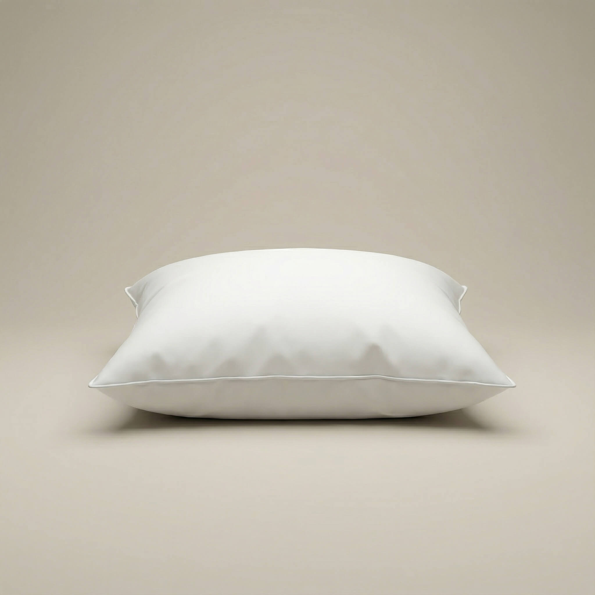 A plush white cushion insert with smooth satin fabric and clean stitched edges for extra comfort