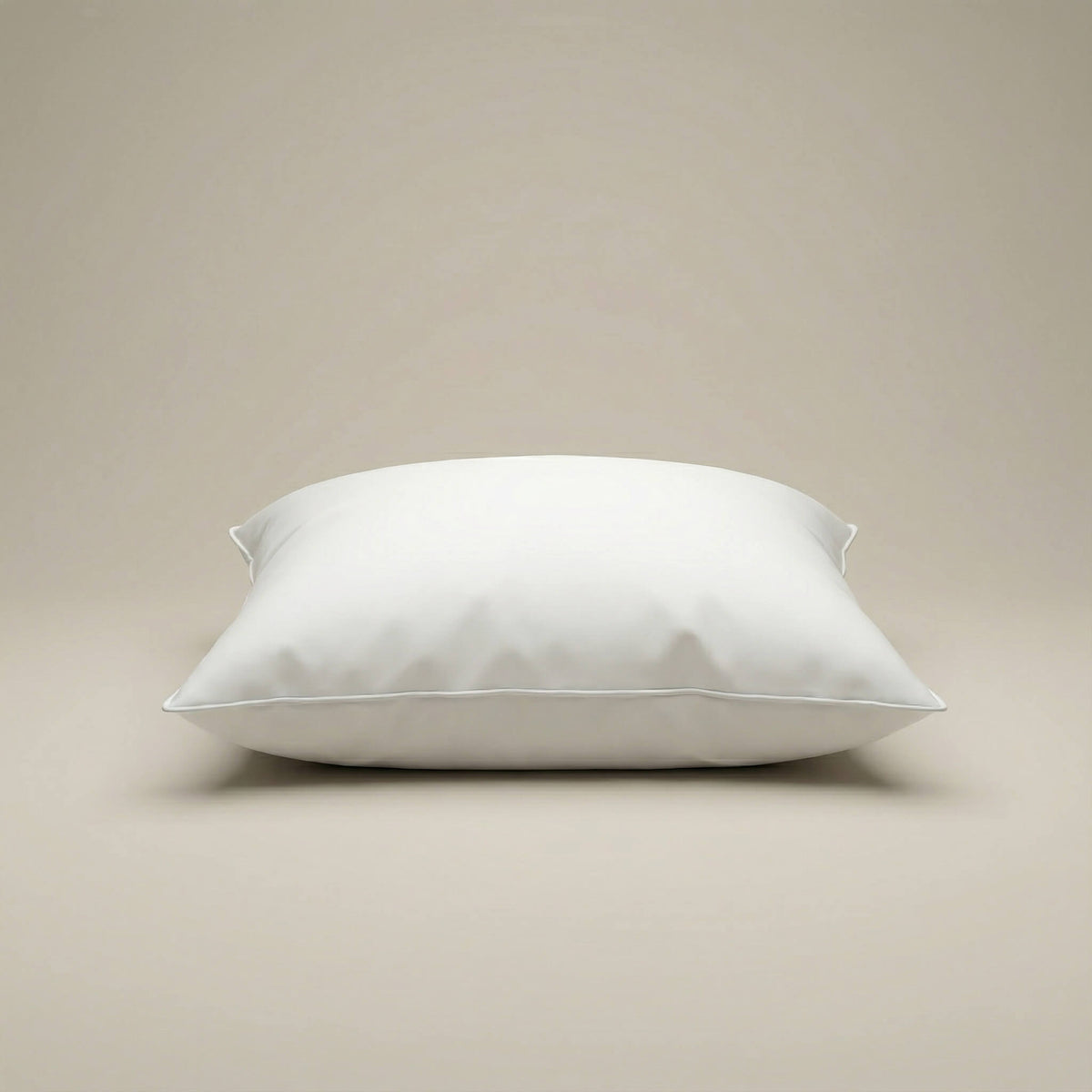 A plush white cushion insert with smooth satin fabric and clean stitched edges for extra comfort