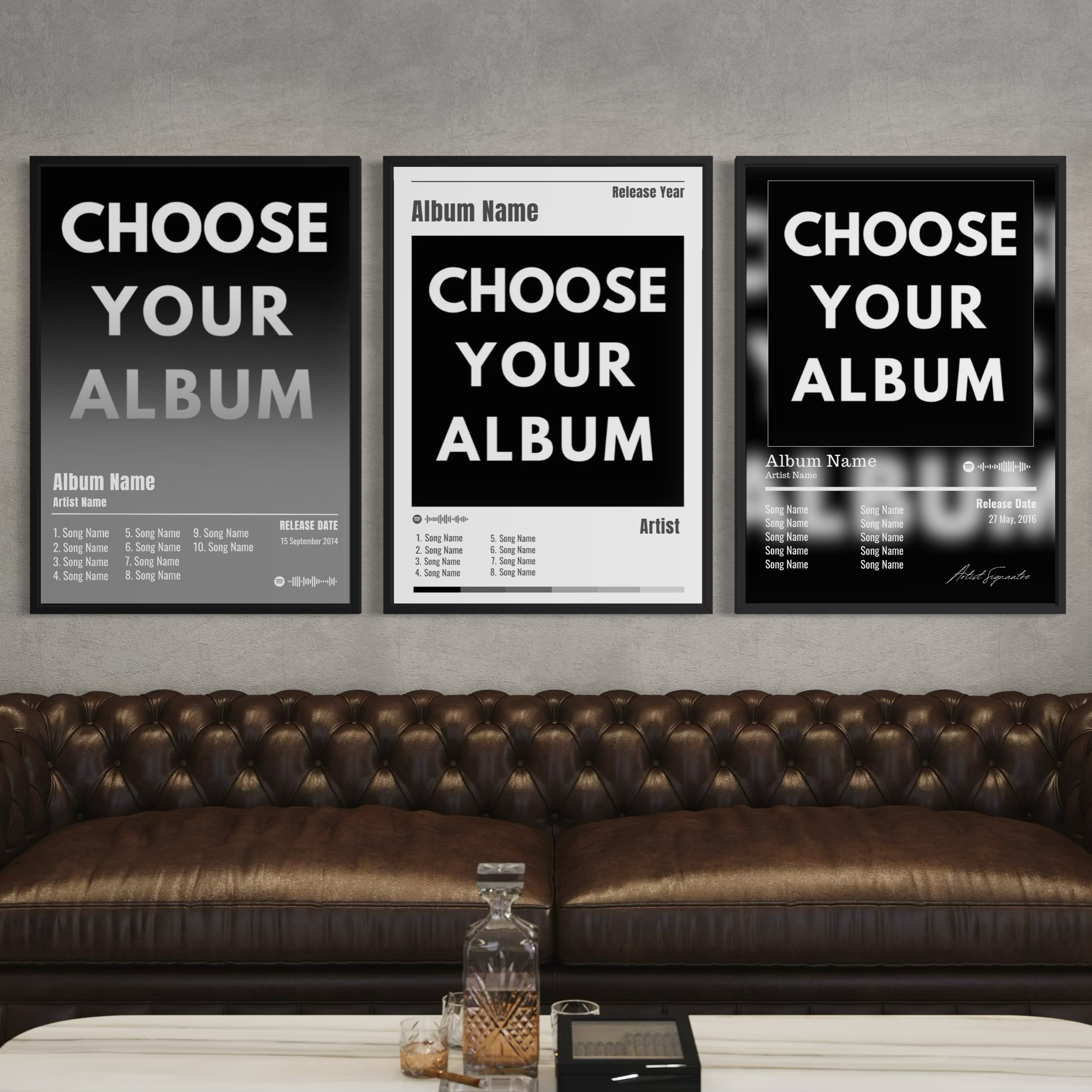 Three framed black and white custom album posters with bold white text above a brown leather sofa for music lovers