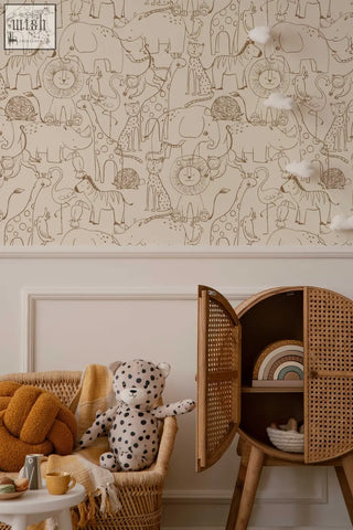 A plush white teddy bear with black polka dots on a wicker chair complements monochrome kids wallpaper from contact clickwalls