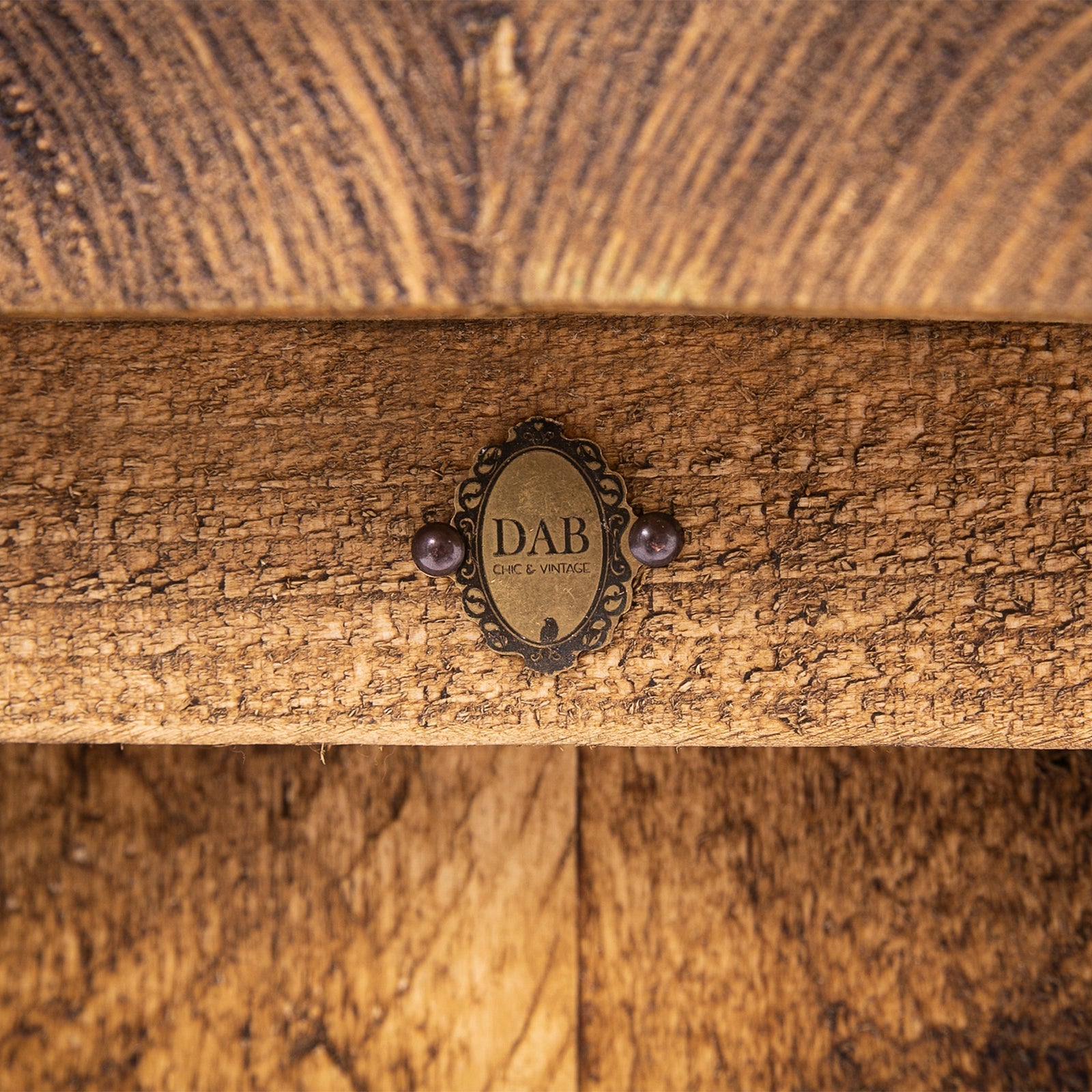 Antique-style brass plaque with black filigree and purple beads on dab chic vintage bar stool for dining room use