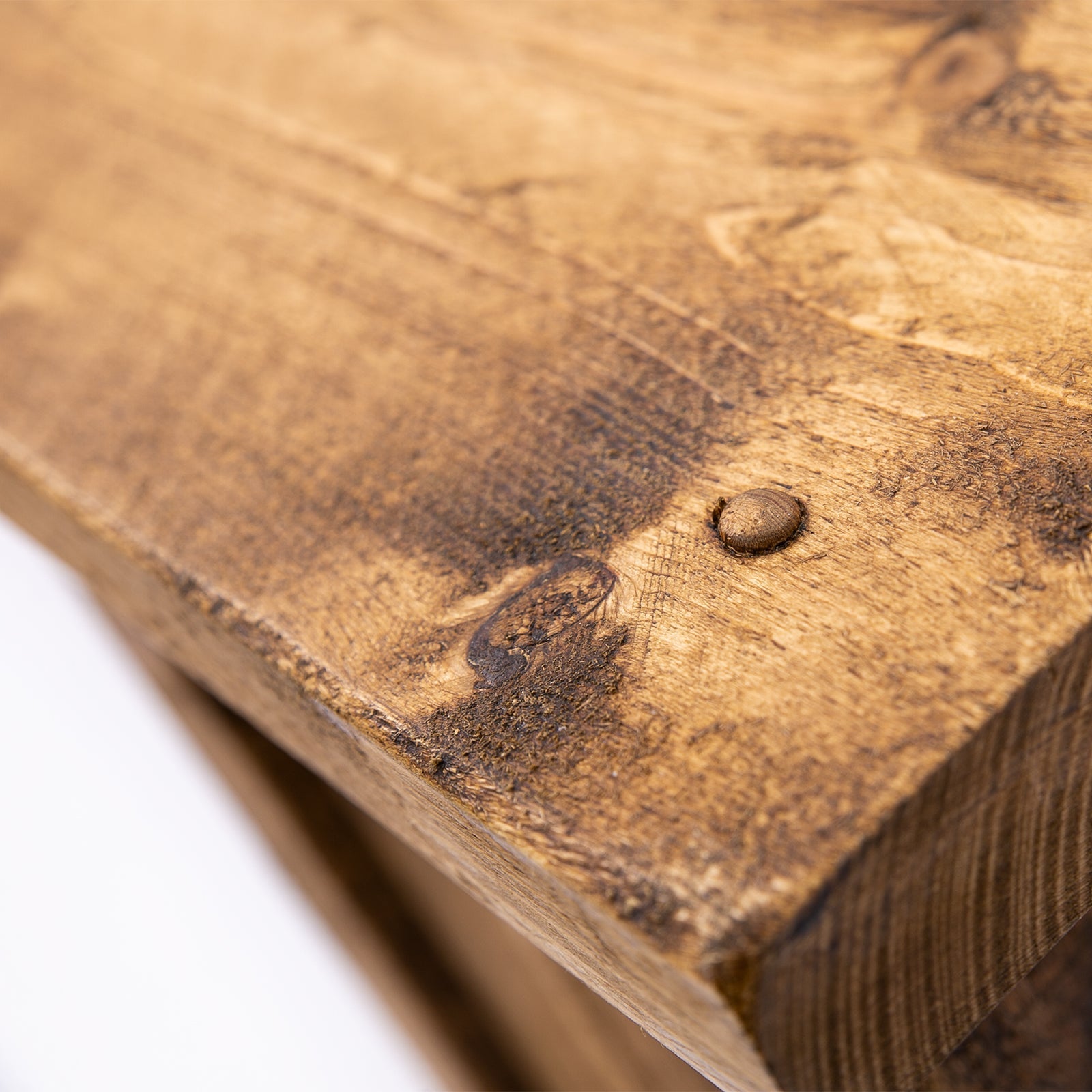 A rustic medium brown wooden plank with visible grain and nail detail for dab’s new all uk wooden bar stool dining room seating