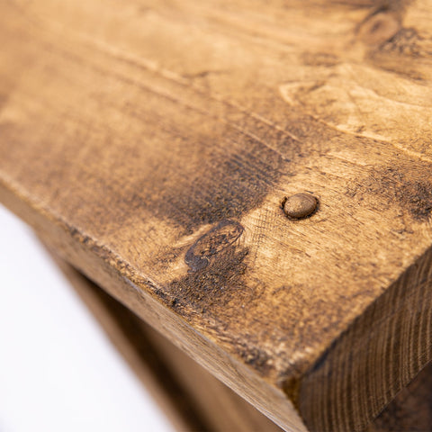 A rustic medium brown wooden plank with visible grain and nail detail for dab’s new all uk wooden bar stool dining room seating