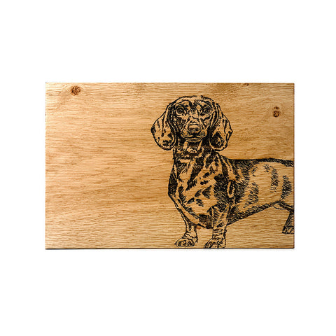 Rustic dachshund oak serving board with dark burned illustration perfect for cheese and snacks