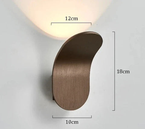 Modern bronze-finished daisuke light wall lights with sleek curved design and warm ambient lighting