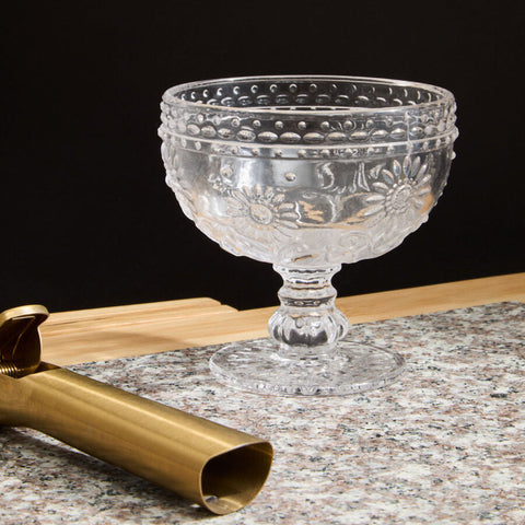 Clear glass sundae glass dish with embossed floral and bead patterns on pedestal base perfect for desserts