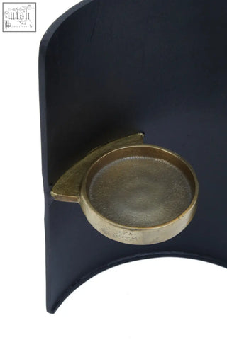 Dark blue leather bookend with brass circular accent for daito black and gold finish candle holder display