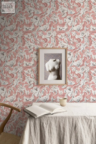 A framed black-and-white photo of a white marble sculpture in a light wood frame perfect for dalis mermaid blush wallpaper use