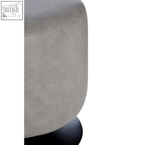 Dalston ash grey faux leather pouffe with a rounded cushioned seat and sleek black base gray faux leather stool