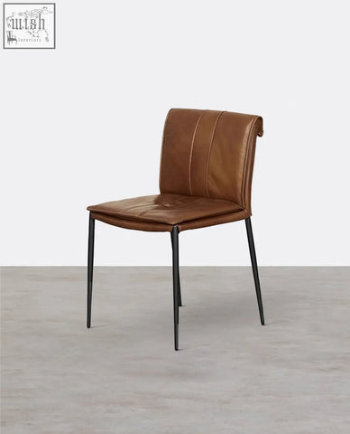 Brown leather d’amato dining chair with tufted backrest and sleek black metal legs perfect for any dining space
