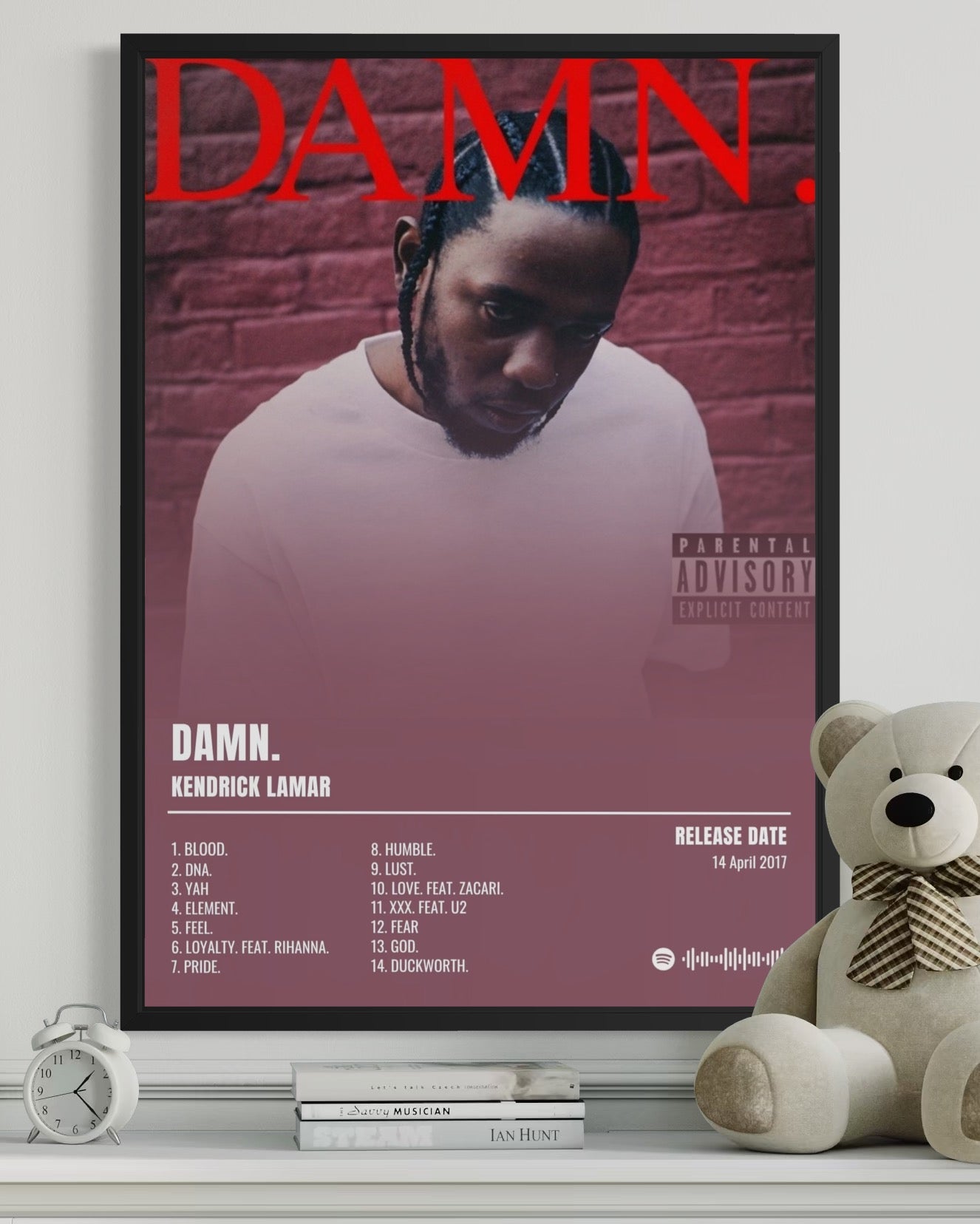 Black-framed kendrick lamar album poster damn with bold red lettering pink purple gradient and spotify barcode details