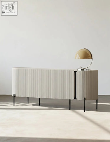 Cream-colored damon sideboard with vertical ribbed wood texture and slender black legs perfect blend for dining area