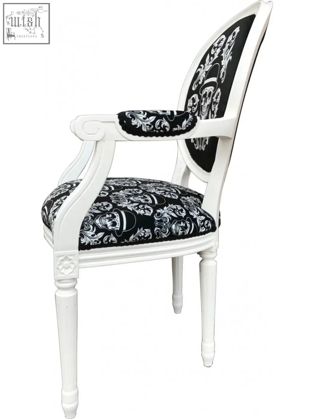 White wooden bowler arm chair by dan gold with black skull and floral upholstered seat and back