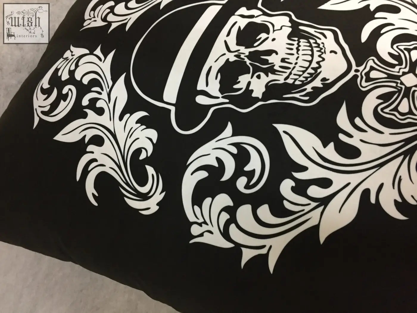 Black dan gold bowler cushion pillow with bold white skull and ornate floral design perfect for edgy decor
