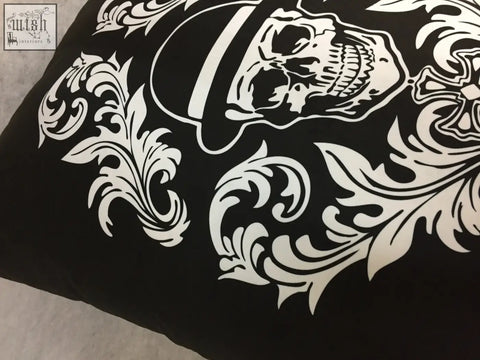 Black dan gold bowler cushion pillow with bold white skull and ornate floral design perfect for edgy decor