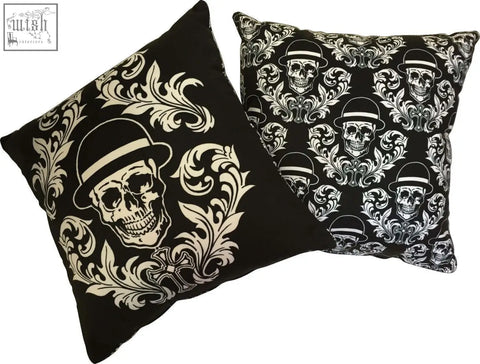 Black dan gold bowler cushions with white skull and floral patterns featuring single and repeating skull designs