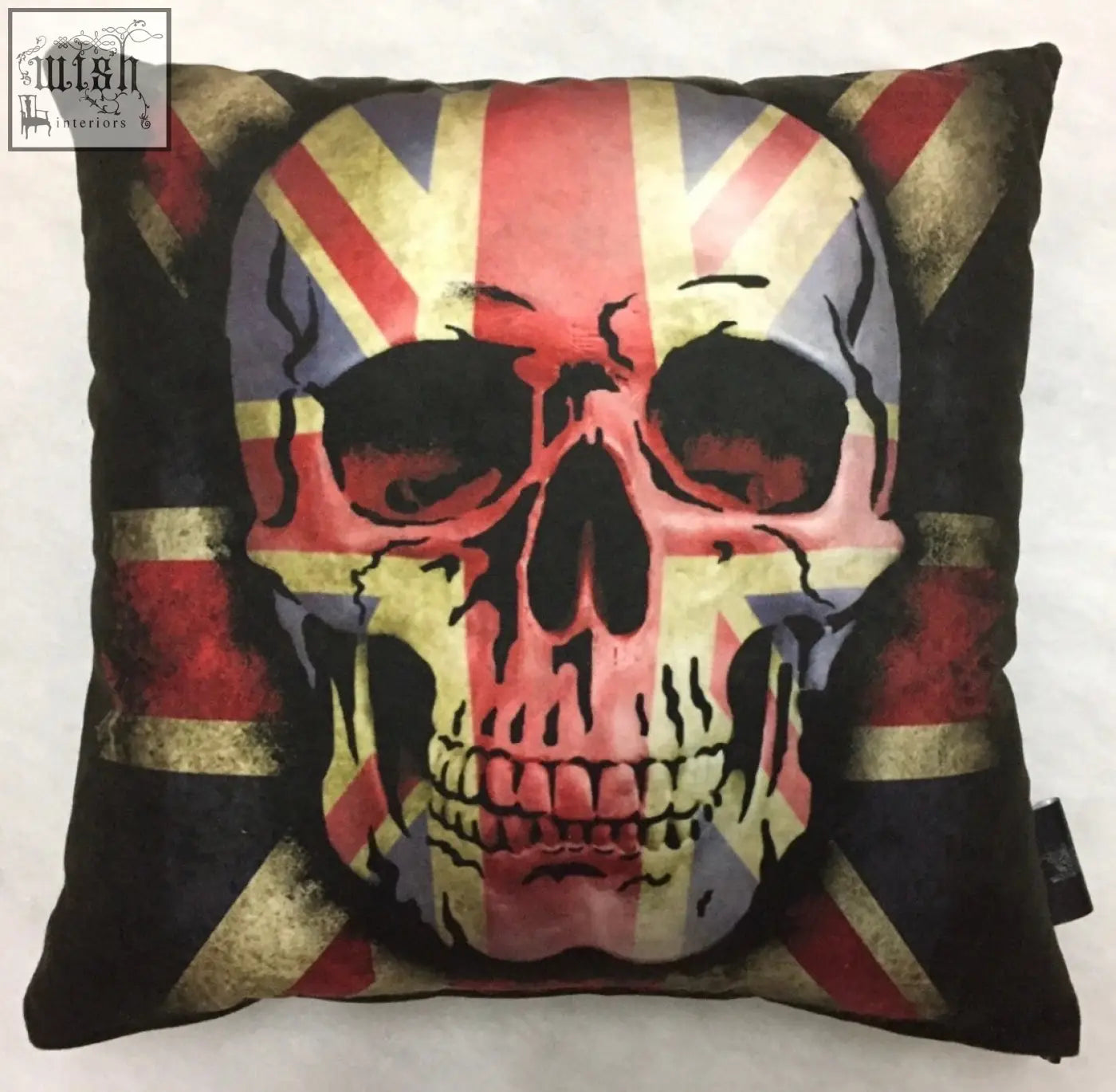 Black dan gold cushion with a distressed union jack and skull graphic perfect for edgy home decor