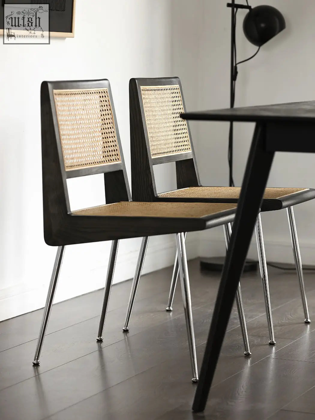 Modern black rattan dining chair with sleek metal legs perfect for stylish dining chairs setup
