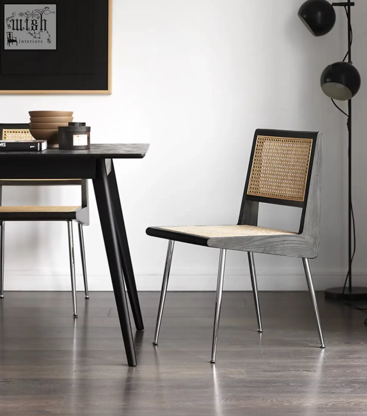 Dana rattan dining chair with gray wood frame, woven cane seat and back, and slender chrome legs for dining use