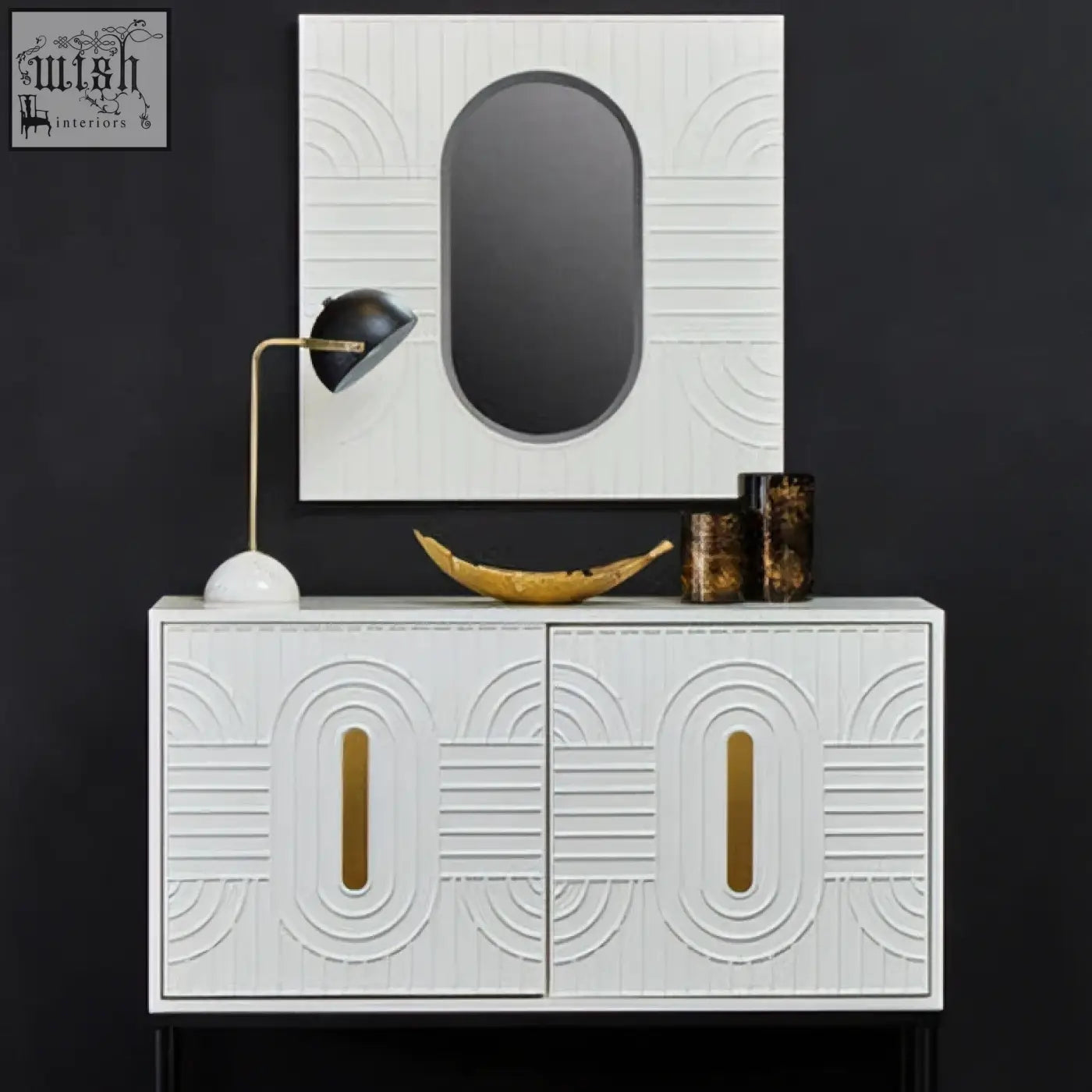 Off-white wall mirror with a white cabinet featuring gold-toned vertical handles and a geometric embossed pattern