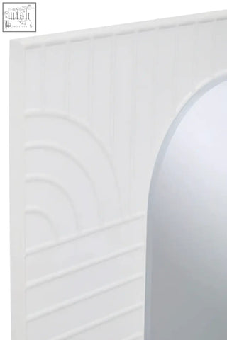 Off-white wall mirror with white textured wall panel and curved arch design in danta off white wall mirror