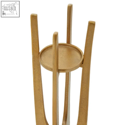 Large gold finish candle holder with gold-toned metal stand featuring four curved legs and circular base