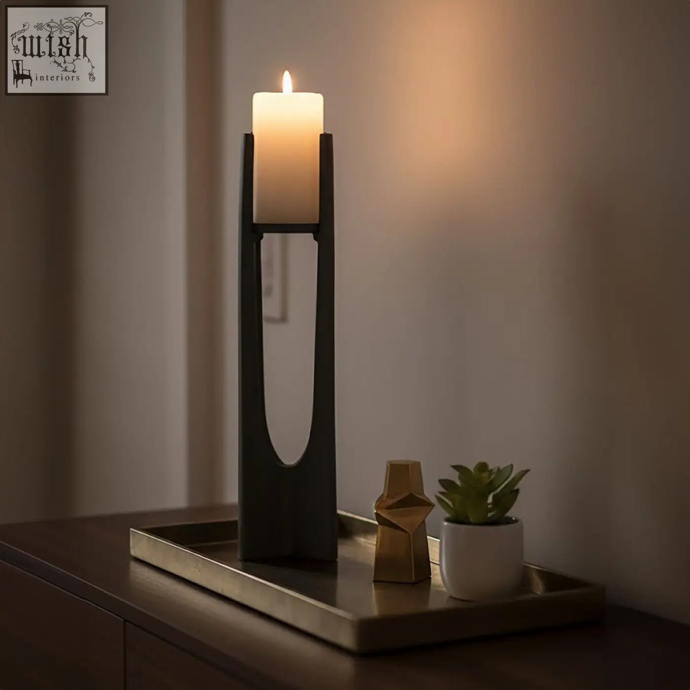 Black minimalist large grey candle holder with sleek modern design holding an ivory pillar candle