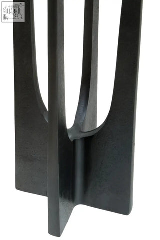 Black metal side table with sleek modern vertical slats and matte finish perfect for large grey candle holder with pillar candles